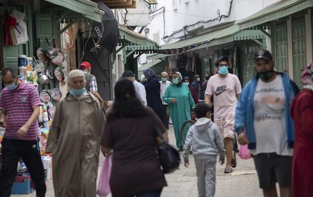epa08481229 Citizens on bougroun Street wear mandatory face masks to prevent the spread of the coronavirus, in Rabat, Morocco, 12 June 2020. Morocco decided to gradually reduce the closing procedures and extended the public health emergency until July 10, according to a joint statement from the Ministry of Health and Ministry of Interior.  EPA/JALAL MORCHIDI