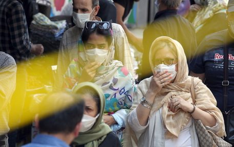 epa08517615 Iranians wearing face masks walk at a street, in Tehran, Iran, 30 June 2020. According to figures released by the Iranian Health Ministry on 29 June 2020, the country recorded its highest number of deaths from the coronavirus disease (COVID-19), 162 deaths and more than 2,000 new cases diagnosed within a 24-hour period.  EPA/ABEDIN TAHERKENAREH