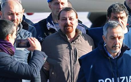 Former far-left militant Cesare Battisti arrives escorted by Italian police at Rome's Ciampino airport, Italy, 14 January 2019. Cesare Battisti, 64, a former member of the far-left terrorist group Armed Proletarians for Communism (PAC), was arrested in Bolivia after 38-years as a fugitive of the Italian justice. He is set to serve a life sentence for four murders committed in Italy's 'years of lead' of political violence in the 1970s and 1980s, media reported. ANSA/ETTORE FERRARI