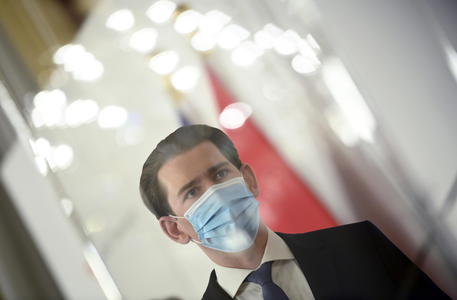 epa08820234 Austrian Chancellor Sebastian Kurz wears a mask during a press conference at the Austrian Chancellery in Vienna, Austria, 14 November 2020. The Austrian government announces to tighten and extend the current lockdown to slow down the ongoing pandemic of the COVID-19 disease caused by the SARS-CoV-2 coronavirus. Stricter measures include restrictions concerning the movement of individuals and the closing of all non essential businesses and educational institutions.  EPA/CHRISTIAN BRUNA