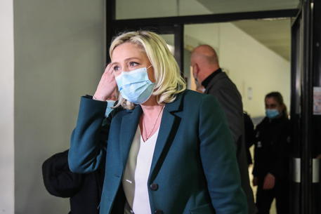 epa09001859 French member of Parliament and president of the Rassemblement National far-right party Marine Le Pen leaves the court after a trial at the Tribunal De Grande Instance, in Nanterre, a Paris suburb, France, 10 February 2021. Marine Le Pen and Gilbert Collard, a party colleague, face charges of breaking hate speech laws by tweeting pictures of Islamic State (ISIS) atrocities in 2015.  EPA/MOHAMMED BADRA