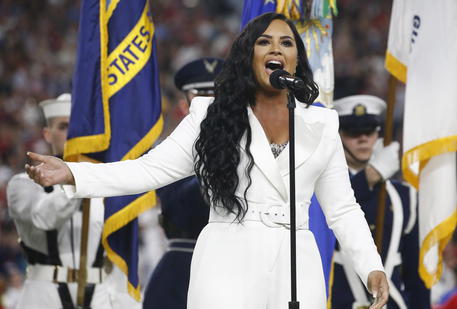 epa08189243 US singer Demi Lovato performs the National Anthem before the AFC Champion Kansas City Chiefs play the NFC Champion San Francisco 49ers in the National Football League's Super Bowl LIV at Hard Rock Stadium in Miami Gardens, Florida, USA, 02 February 2020.  EPA/LARRY W. SMITH