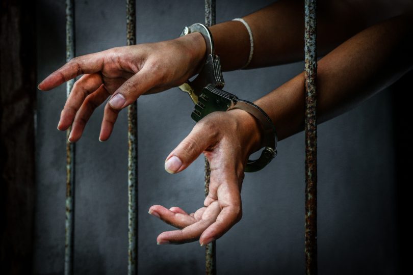 Prisoner in prison with handcuff